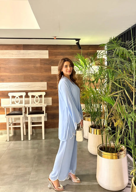 mohsin-saeed-fabrics-designer-daily-wear-formal-and-wedding-suits-within-budget-This-product-is-from-manahils-ice-blue-hem-co-ord-set-is-available-on-Mohsin-saeed-fabrics-website.