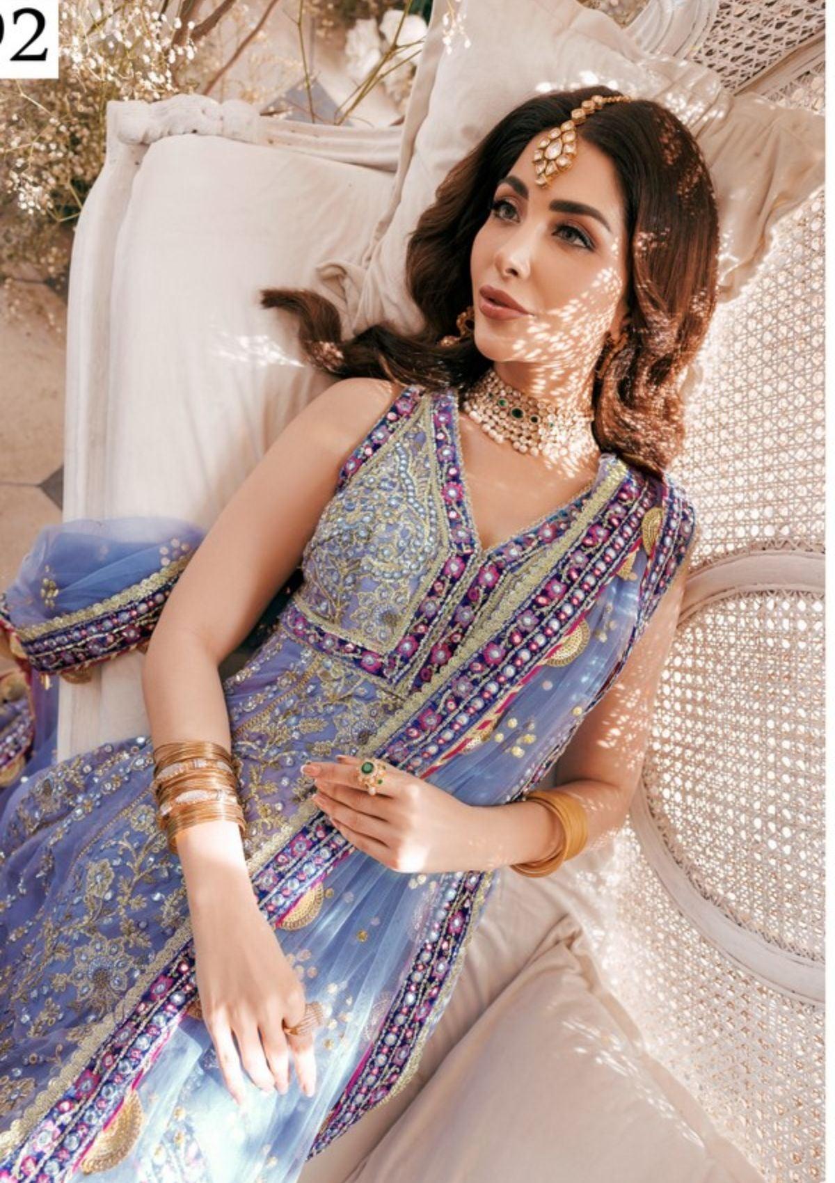 Embroidered Ada work and heavily Embellished Wedding & formal dresses available at mohsin saeed Fabrics online store. 